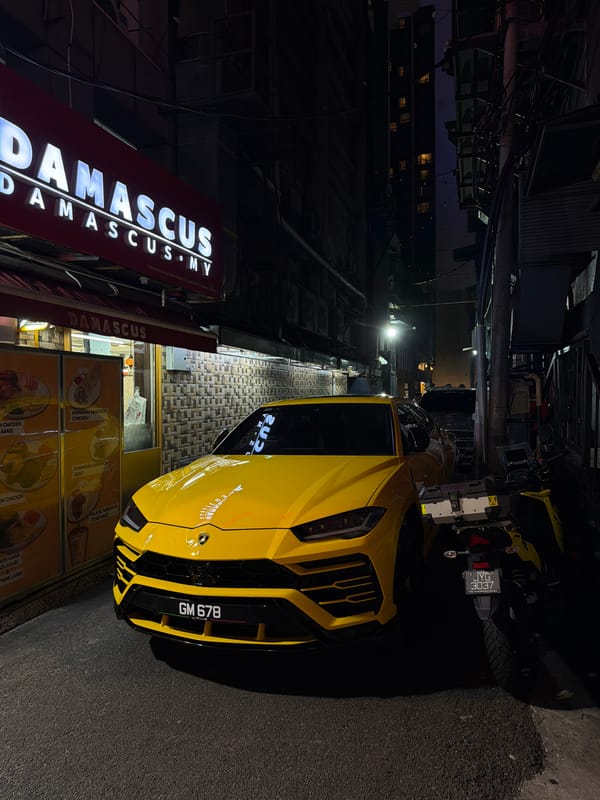 A busy KL night: street food, street dance, and a Lambo