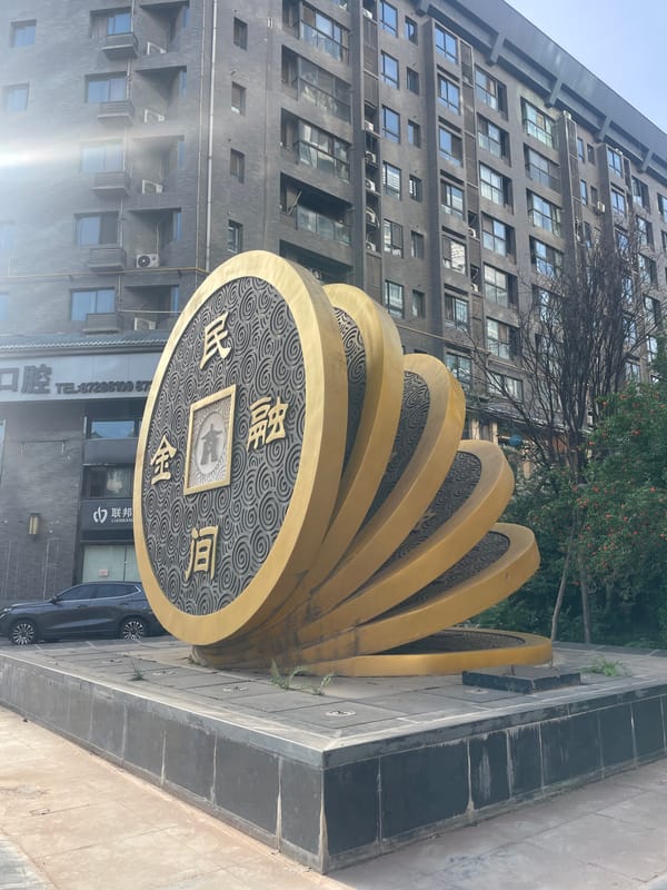 Golden coin sculpture spotted in Xincheng District, China