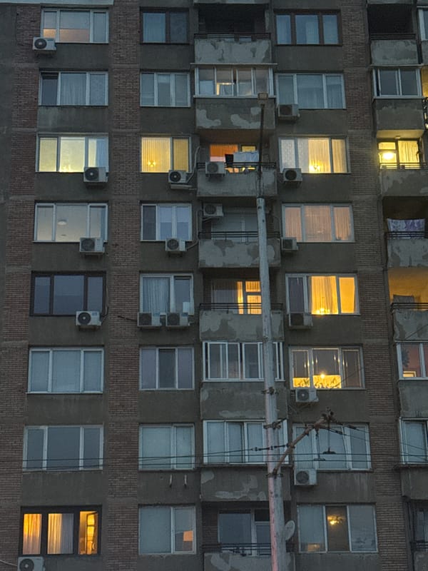 Evening lights illuminate Sofia apartment building windows