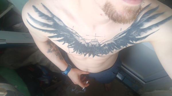Relaxed morning at home, chest tattoo and everyday objects