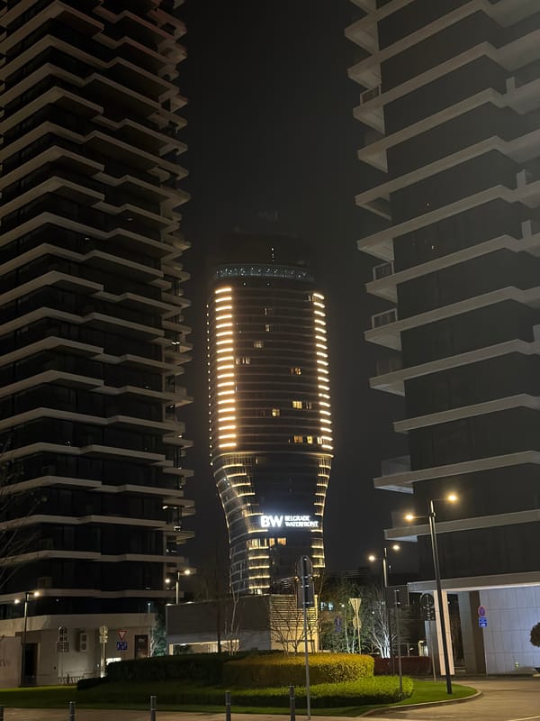 Belgrade Waterfront hotel illuminated in nighttime scene