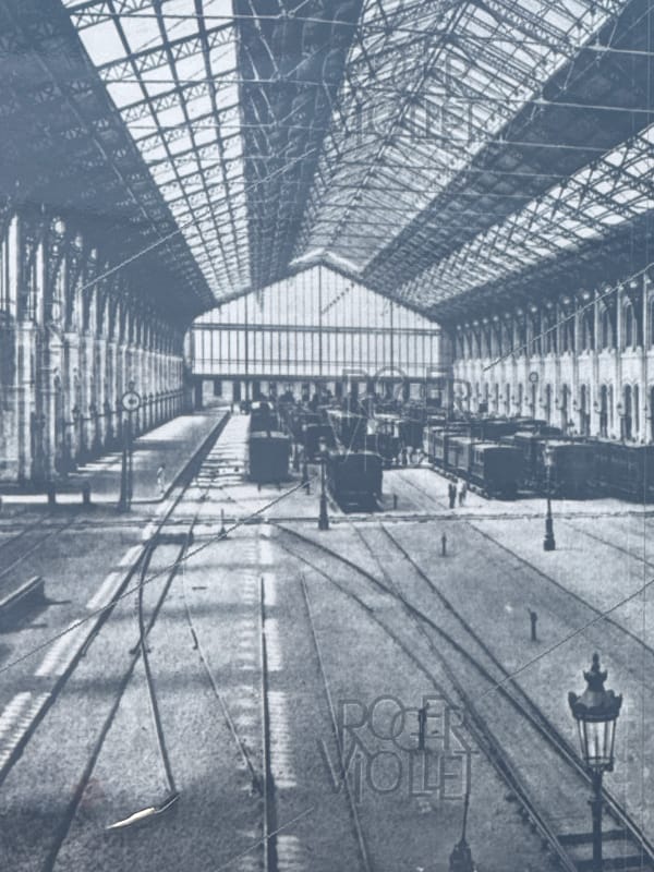 Inside a grand Paris station, tracks and ornate halls