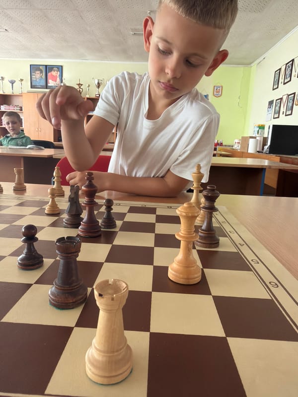 Chess session with focused board play and a tic-tac-toe cameo