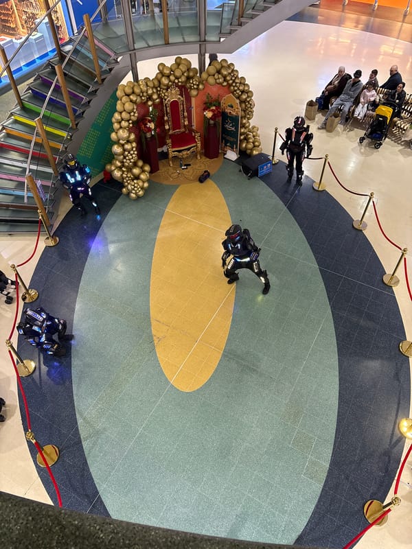 Costumed performers stage coordinated dance shows in London malls