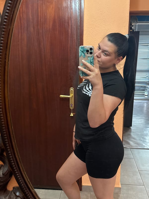 Woman takes morning selfies indoors in Rogosh, Bulgaria