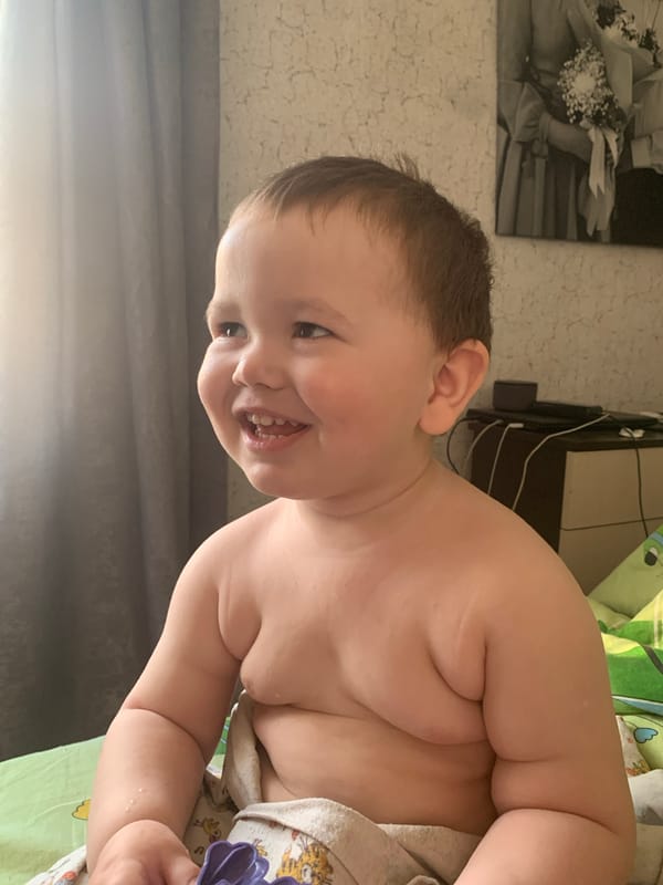 Baby and woman photographed in domestic setting in Foki
