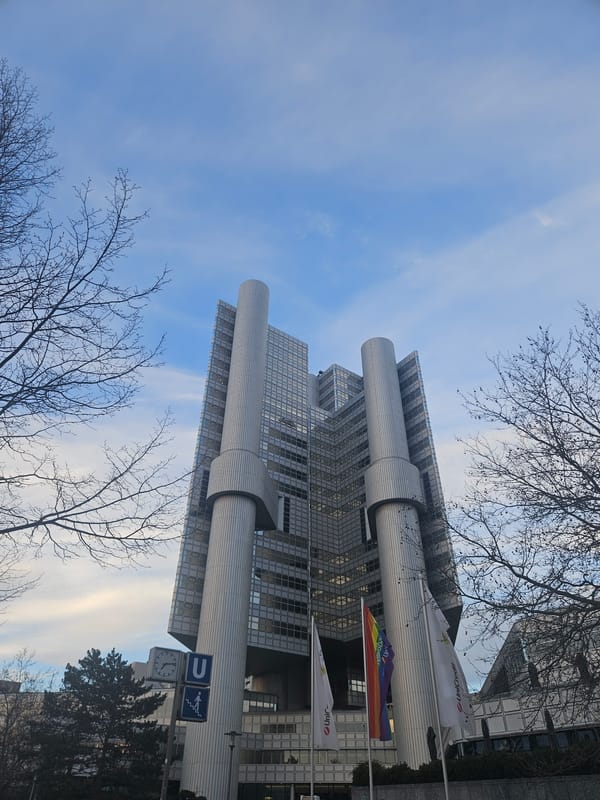 Munich HVB Tower photographed from below against blue sky
