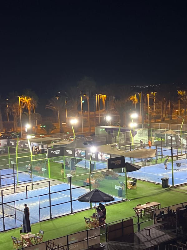 Illuminated padel courts observed during nighttime in Arica, Chile