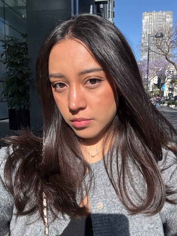 Woman photographed on Mexico City street amid urban shadows