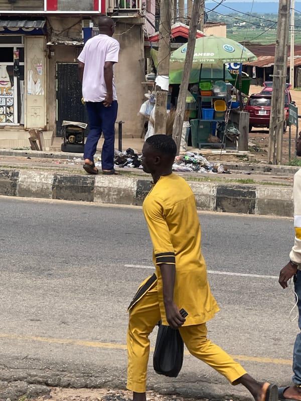 Everyday street life in a busy West African urban neighborhood