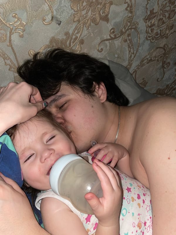 Family shares quiet bedtime moment in Izhevsk home