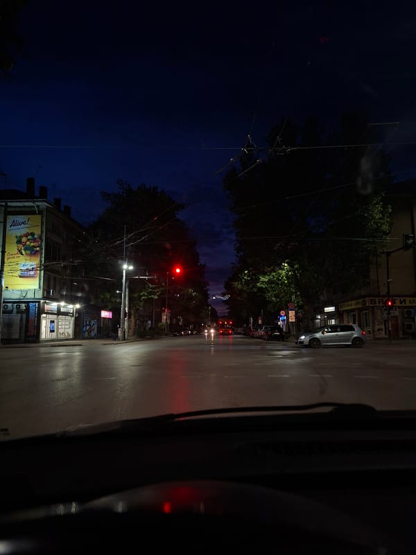 Nighttime street view captured from vehicle in Pleven, Bulgaria