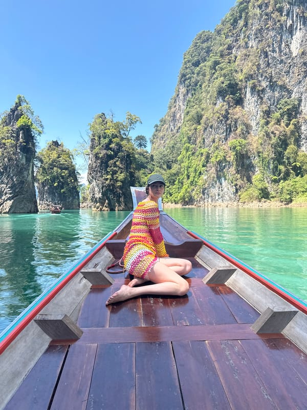 Tourists explore Thailand's Khao Phang limestone karsts by longtail boat