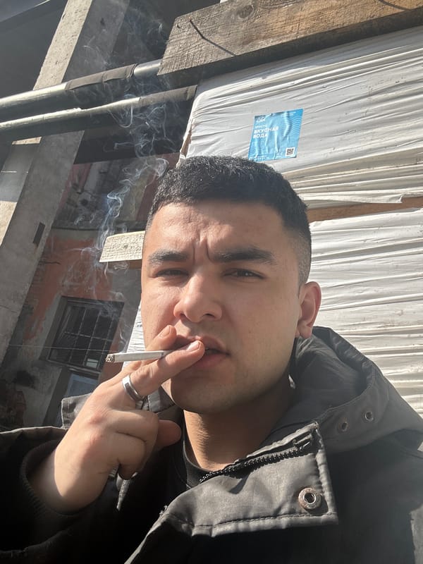 Man photographed smoking cigarette in Fornosovo, Russia