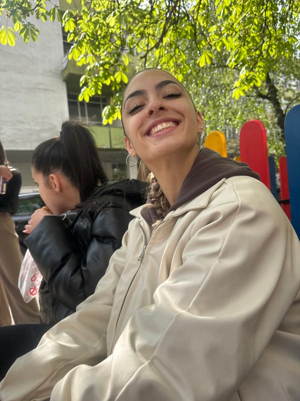 Young people gathered in sunny urban outdoor setting