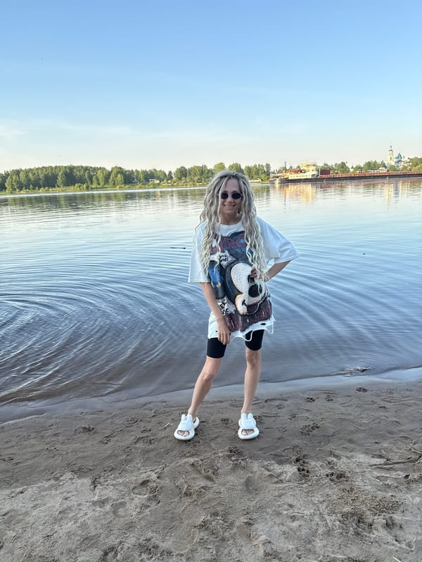 Woman enjoys brief beach visit in Rusanovo, Russia