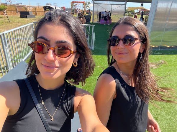 Women take selfie at outdoor festival in Porto