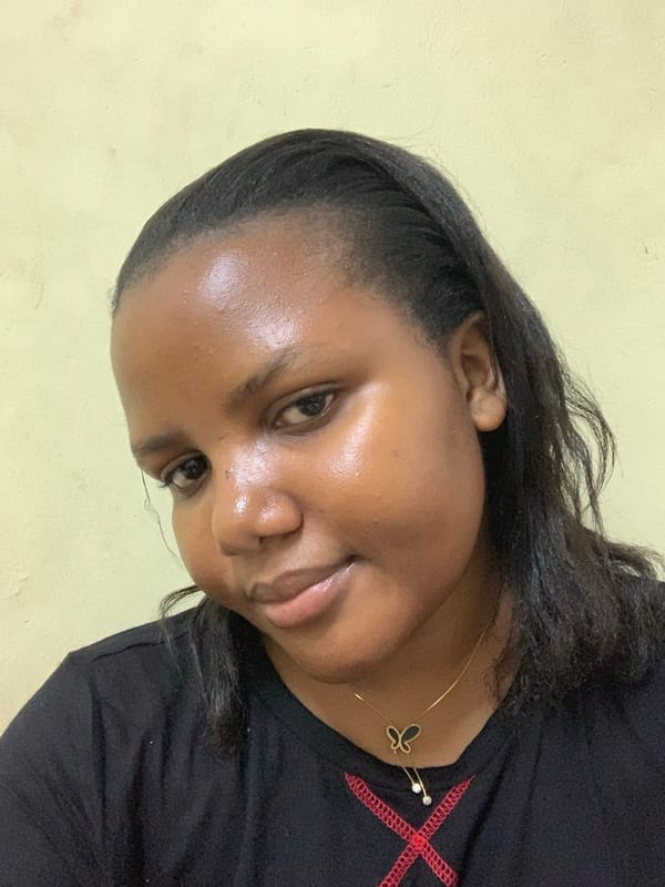 Woman resting on bed observed in Dar es-Salaam