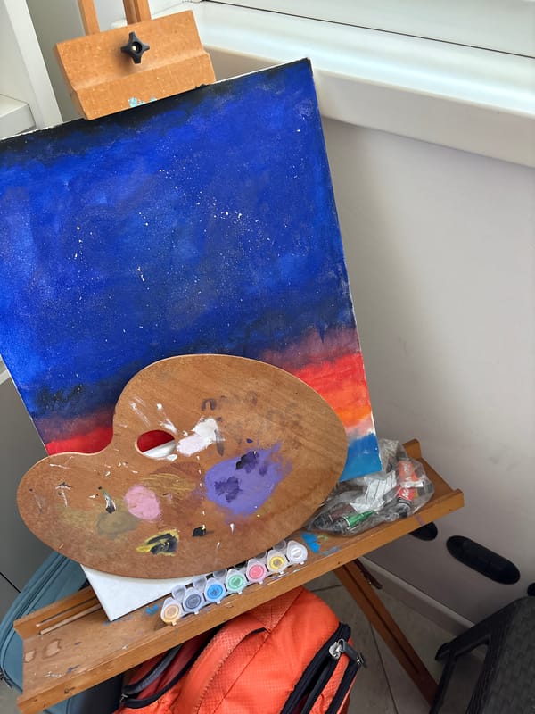 Artist's workspace documented in Milan showing paintings and supplies