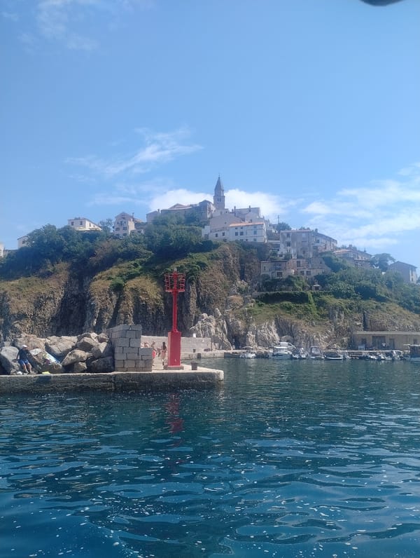 Exploring Vrbnik's coastal cliffs, old town, and Adriatic waters