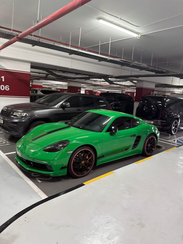 Green Porsche Cayman spotted in underground parking garage