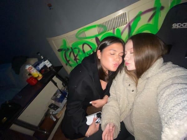 Friends Take Playful Selfies in Chaikovsky Room