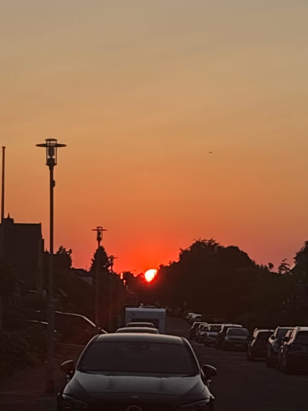 Sunset over a Mönchengladbach street, sky deep orange
