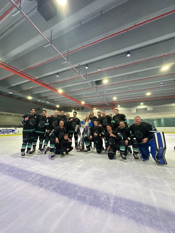 Hockey team celebrates 6–5 win with trophy on Ashdod ice