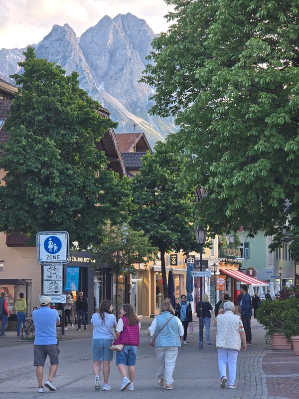 Tourist documents evening stroll through Garmisch-Partenkirchen town center