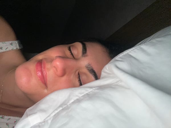 Person rests with closed eyes in Miami Beach