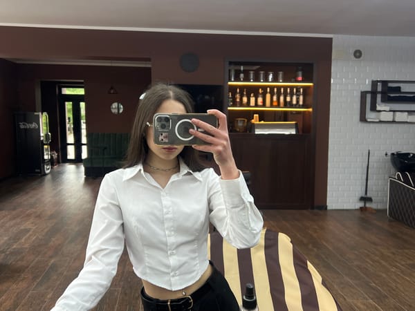 Woman takes selfies in Ternopil hair salon