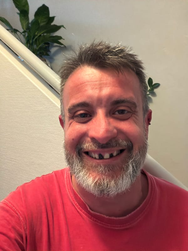 Man poses for indoor portrait photos in Luxembourg