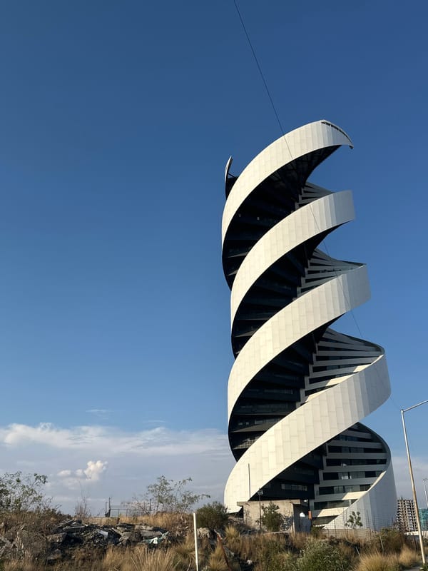Person films Solara Towers from car in Tlaxcalancingo