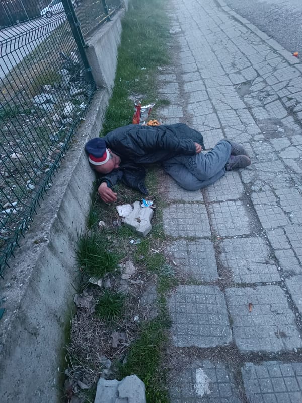 Man lying on sidewalk observed in Asenovgrad, Bulgaria