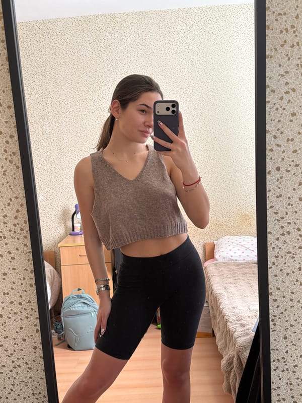Woman takes mirror selfies in Sofia bedroom