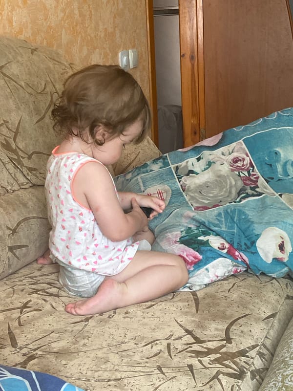 Lazy morning at home with a toddler, selfies, and a cat