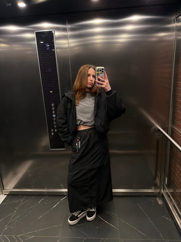 Woman takes selfie in elevator in Gdańsk