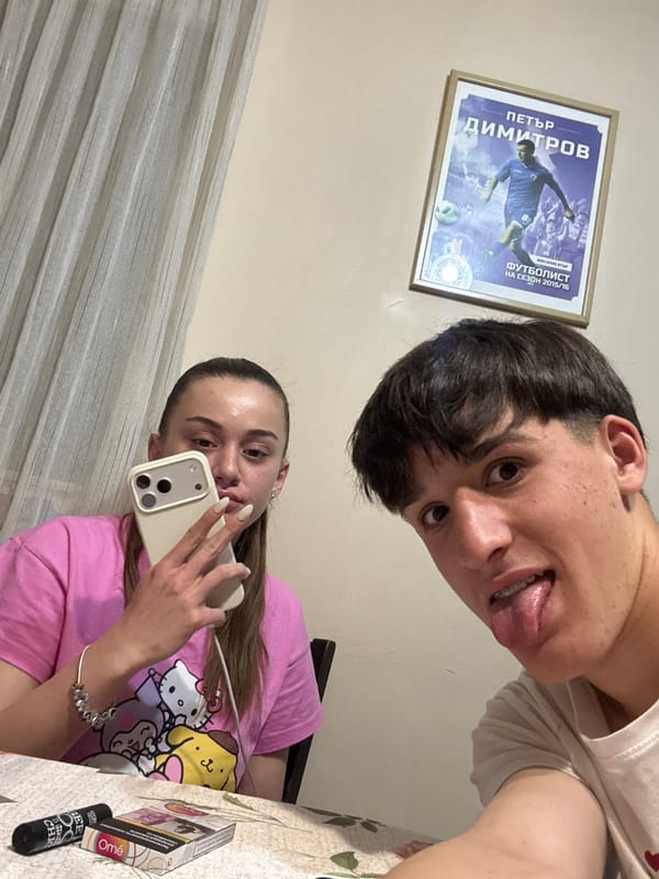 Young couple photographed making playful expressions in Bulgarian town