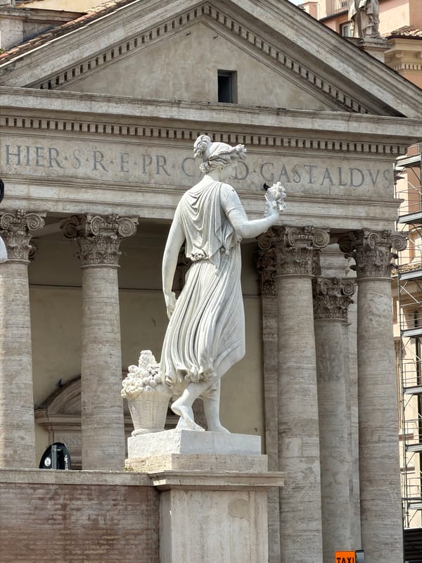 Morning street life unfolds around Rome's historic monuments