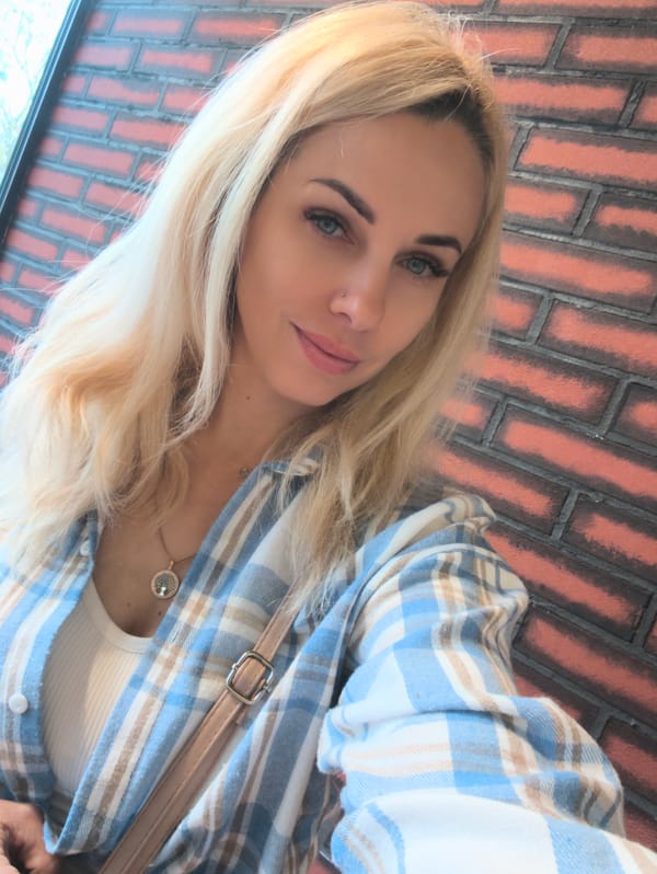 Woman poses with fresh strawberries in Sevastopol selfie session