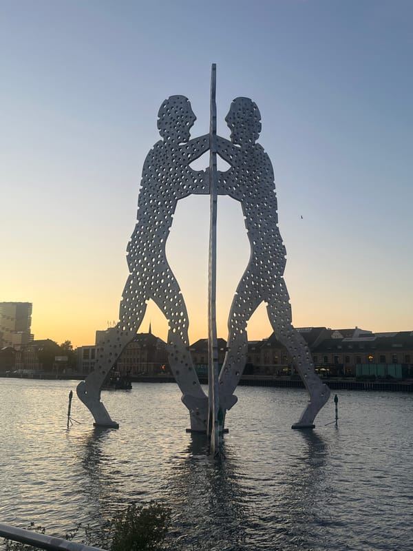 East Side Gallery sculpture and Spree River at dusk, Berlin