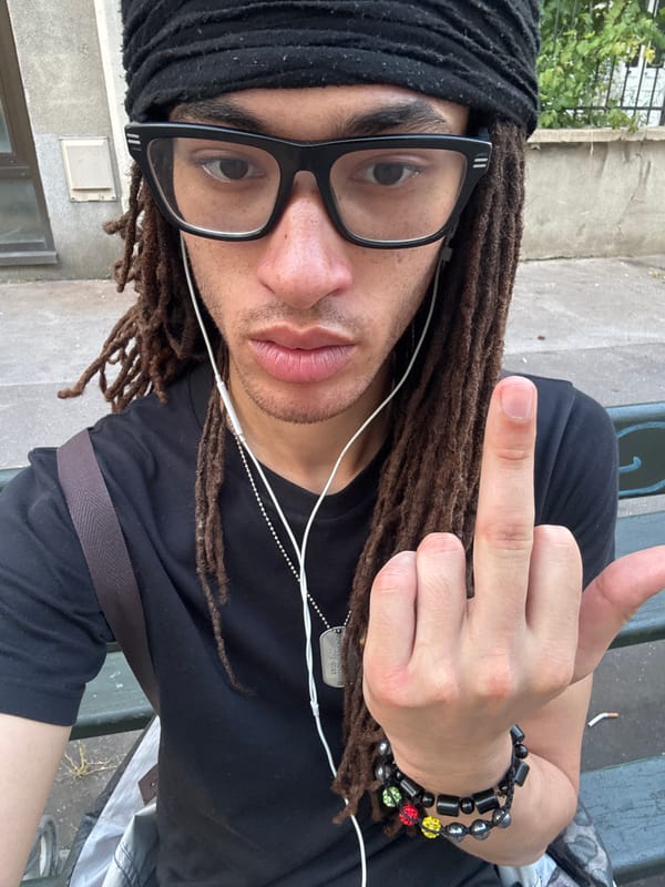 Person with dreadlocks spotted wearing headphones in Paris