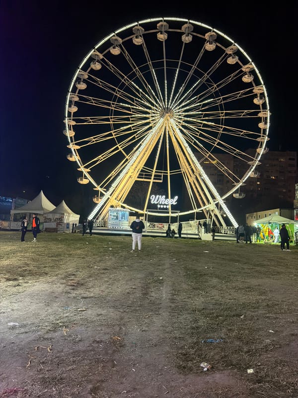 Nighttime carnival operates with illuminated rides in Plovdiv, Bulgaria
