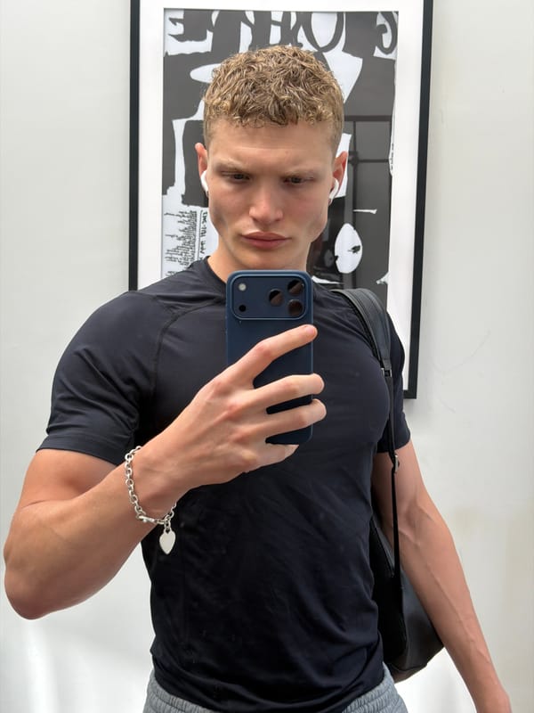 Young man takes mirror selfie in London
