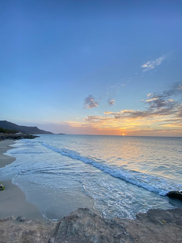 Sunset observed over calm ocean at Juan Griego, Venezuela