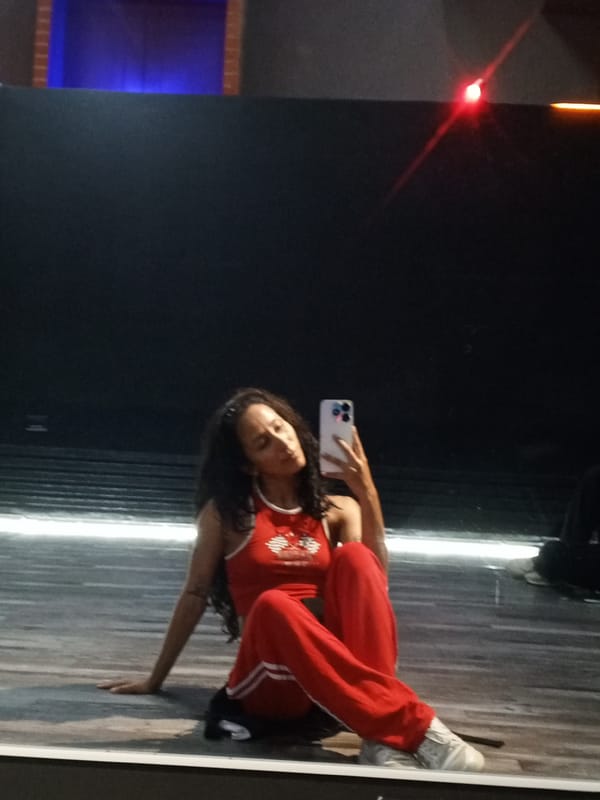 Woman takes selfies in dance studio in Pampatar