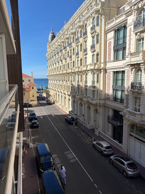 Elevated view captures Carlton Hotel street scene in Cannes