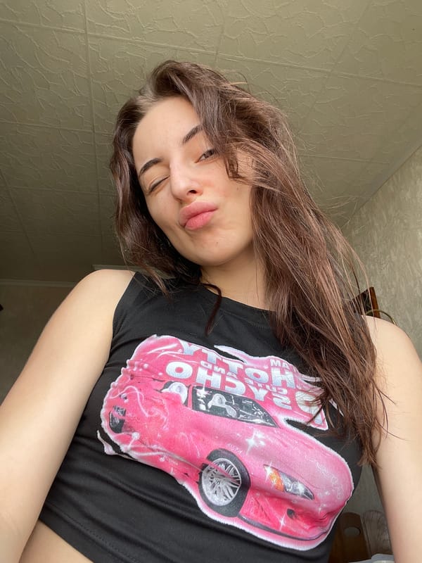 Woman photographed indoors wearing graphic t-shirt in Moscow