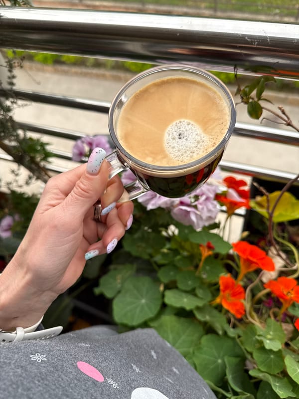 Woman enjoys morning coffee in coastal Montenegro village