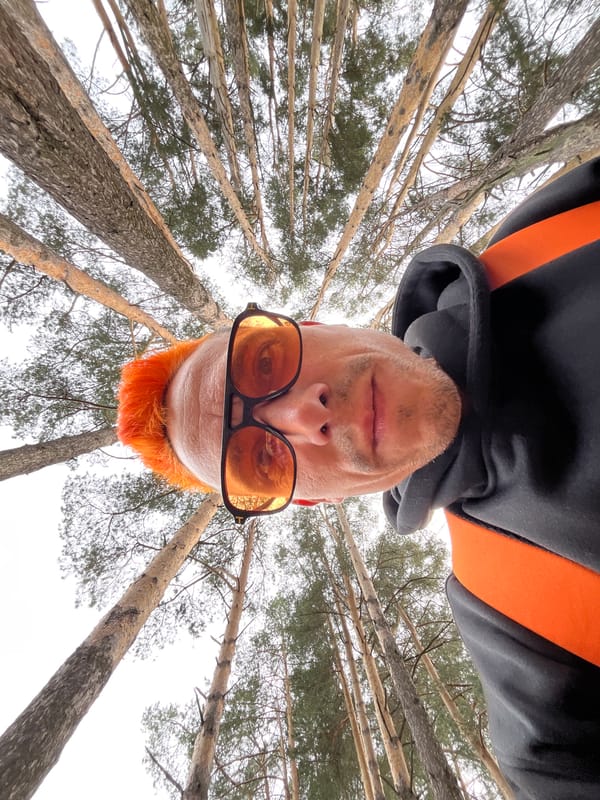 Orange-haired man takes forest selfies with children in Russia